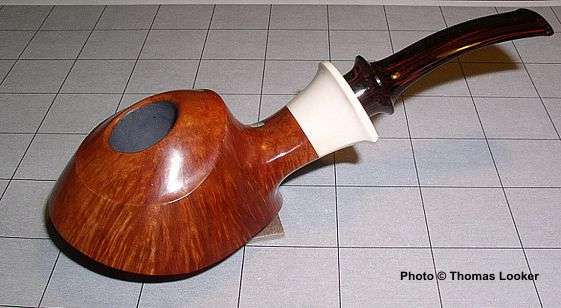 Disk-pipe with mastodon ivory ferrule.  (Carved shortly after the Snail Grade, horn-ferrule disk pipe, SPC 243.)