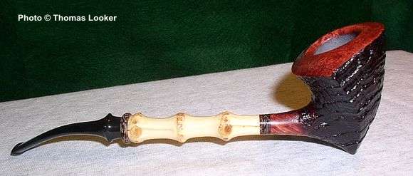 Asymmetric pick-axe (or elephant's foot) variation with bamboo and palm wood ring and inlay, 2003