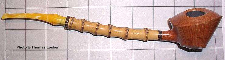 Tokutomi "Disk" and blowfish variation (a new shape in itself), with bamboo, palm wood ring, and amber stem,  Snail Grade, 2004.  One of the most extraordinary pipes Tokutomi-san has yet created.  Photo essay to come.