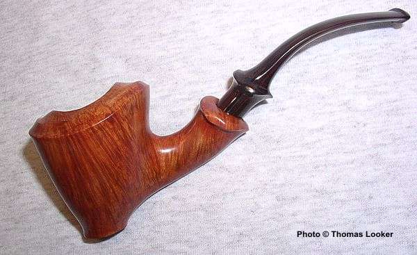 Freehand Dublin with varigated staining, 2004.  Does this narrow bowl with "melted" rim mark the start of a new series of innovative shapes?  (Snail-grade quality grain and design.)