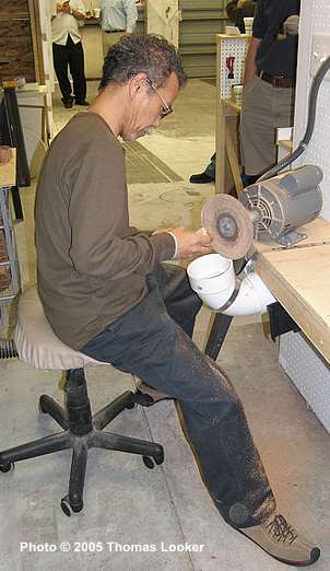 Toku shaping a blowfish sitter in Todd Johnson's workshop, November 2005